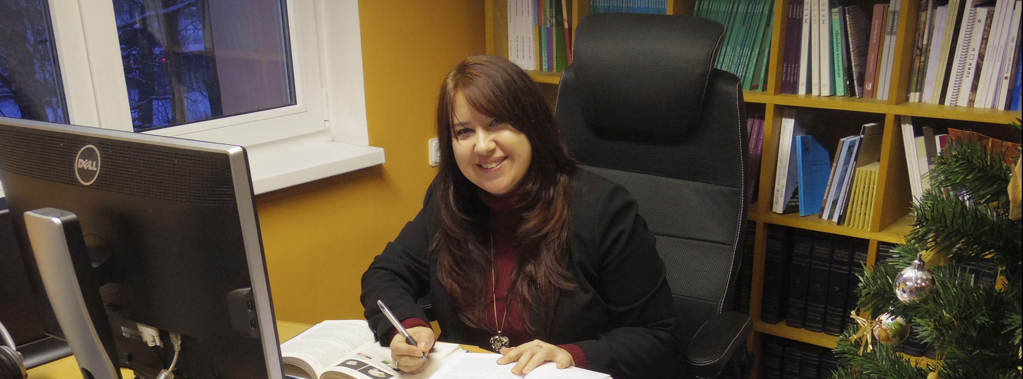  Maria Żukowska is sitting at her desk at the Estonian Literary Museum